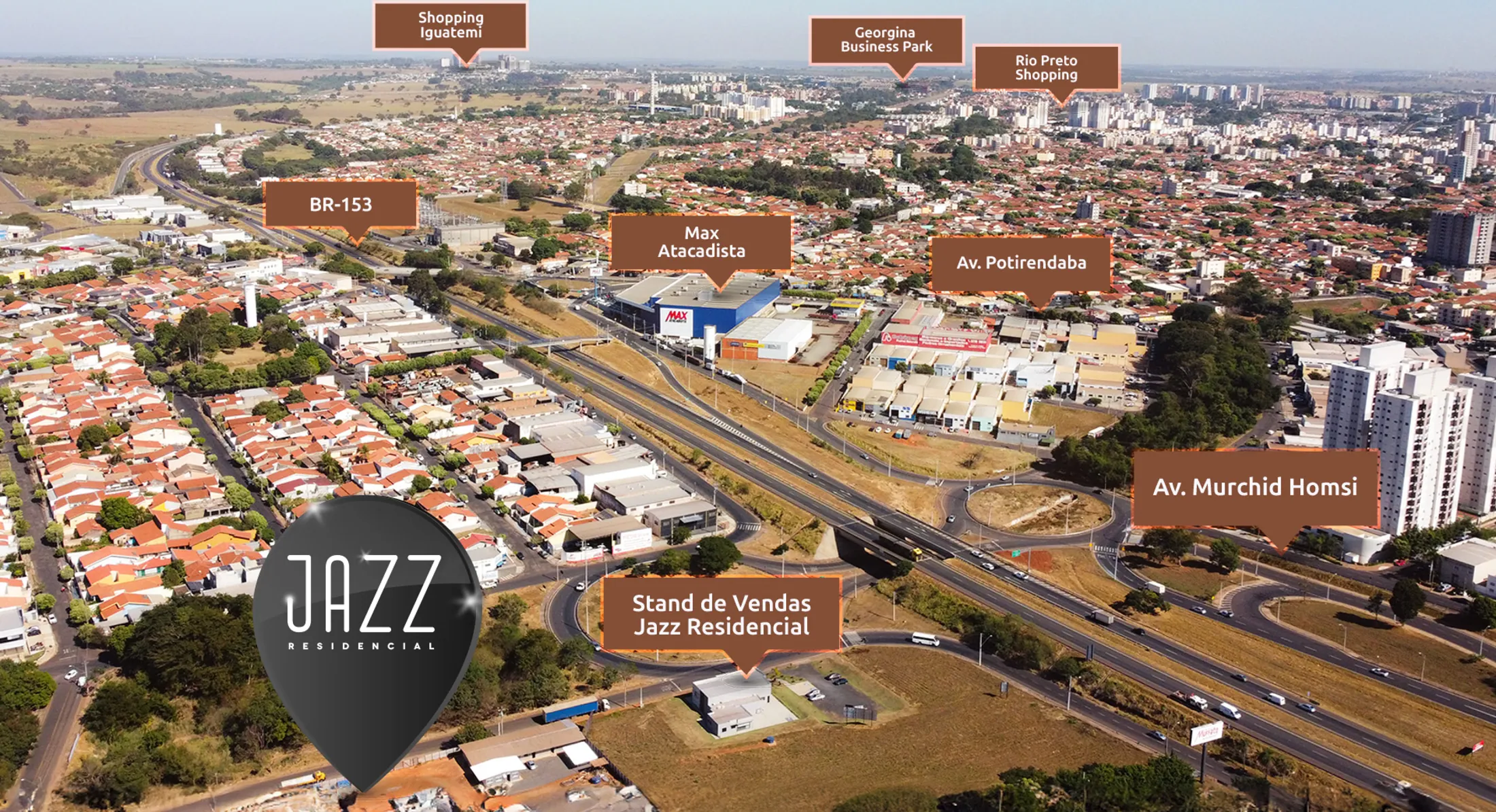 Vista aérea da região do Jazz Residencial com o estande de vendas, a BR-153, o Max Atacadista, as avenidas Potirendaba e Murchid Homsi e os shoppings Iguatemi e Rio Preto ao fundo